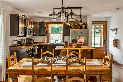 Dining space with woodland views from the cabin windows — a favorite spot for bird watching