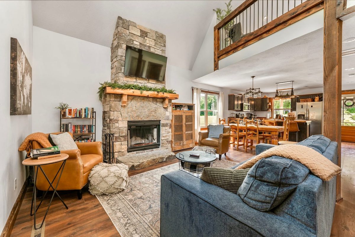 Living room sofa that converts to a sleeper bed, adding flexible sleeping space at the cabin