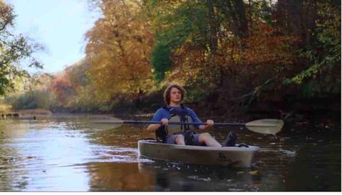 A still from a Bass Pro Shops commercial filmed on the cabin’s riverfront property